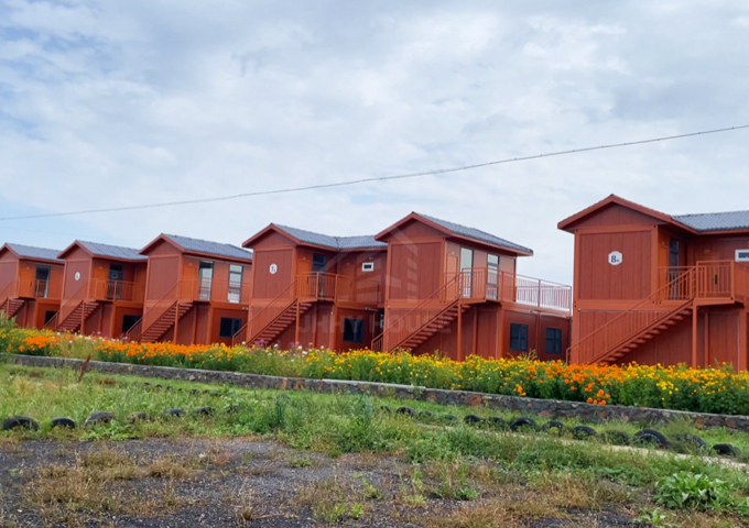 What a beautiful container home community, nestled beside stunning grassland scenery!